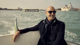Stanley Tucci on a boat in Venice in Stanley Tucci: Searching for Italy