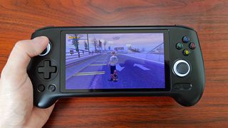 Anbernic RG556 handheld with Tony Hawk's Pro Skater 3 gameplay on screen.