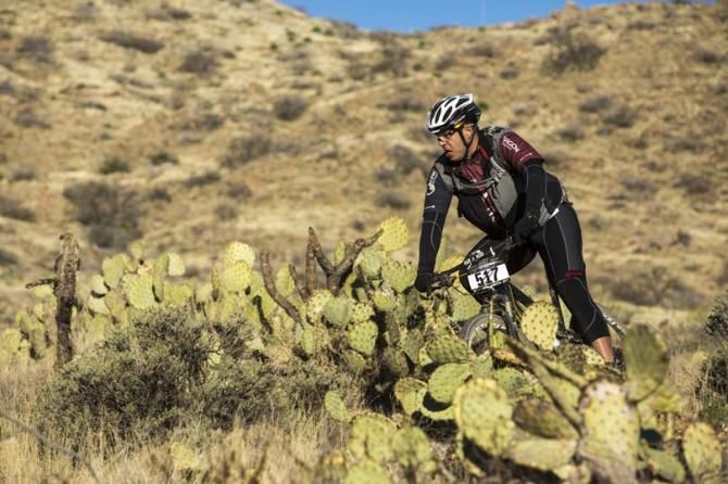 A rider wends his way through the cacti at the 24 Hours of Old Pueblo