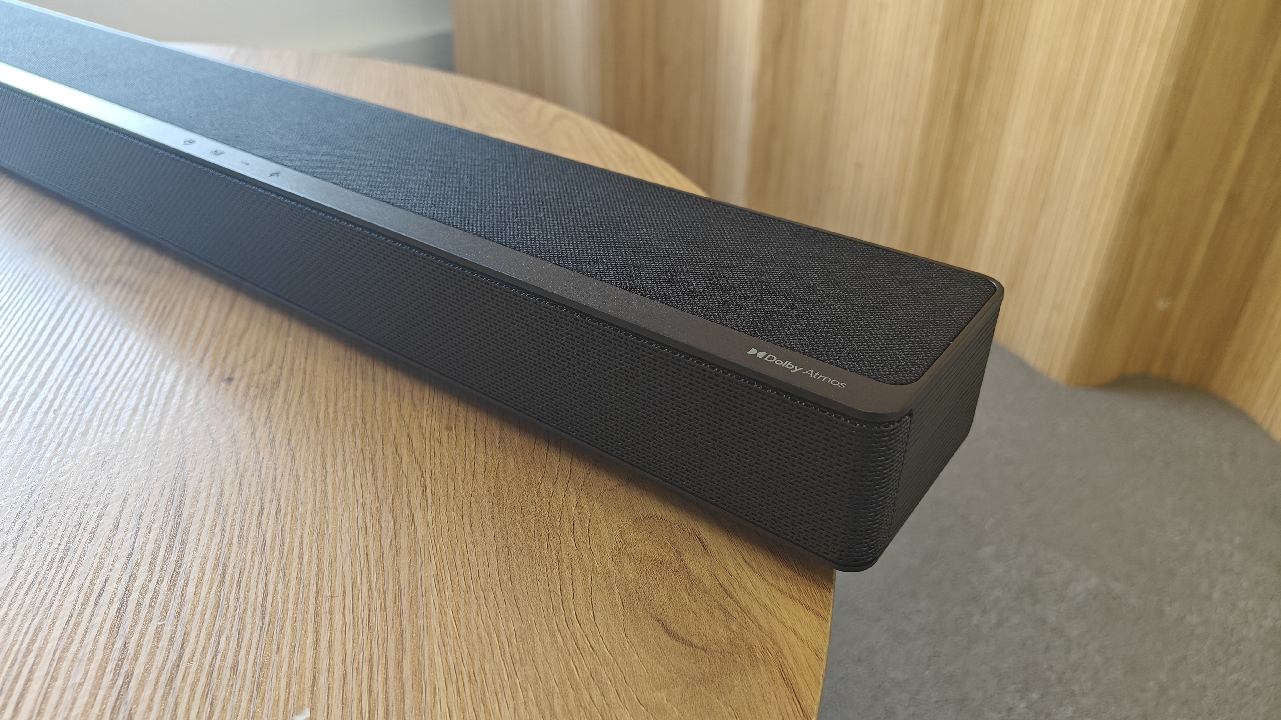 Hisense AX5125H soundbar close up on the Dolby Atmos soundbar logo on the end of the bar.