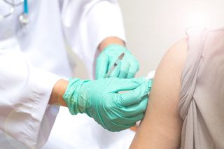 A person getting a flu shot.