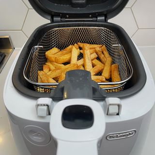 deep fried chips inside a Delonghi deep fat fryer