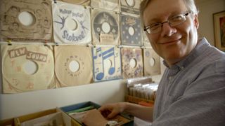 Steve Young browses industrial musical records in Bathtubs Over Broadway