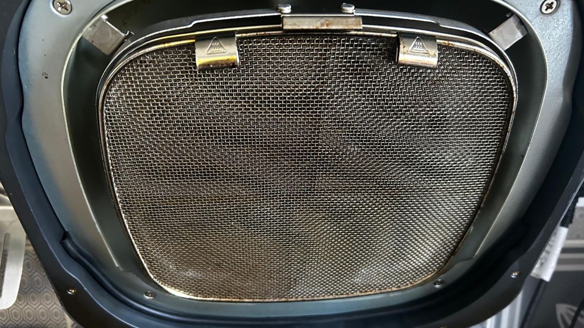 Ninja 5-in-1 Grill and Air Fryer splatter guard at the end of a week of testing