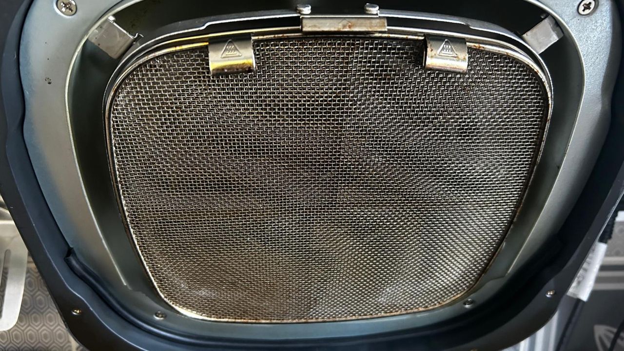 Ninja 5-in-1 Grill and Air Fryer splatter guard at the end of a week of testing