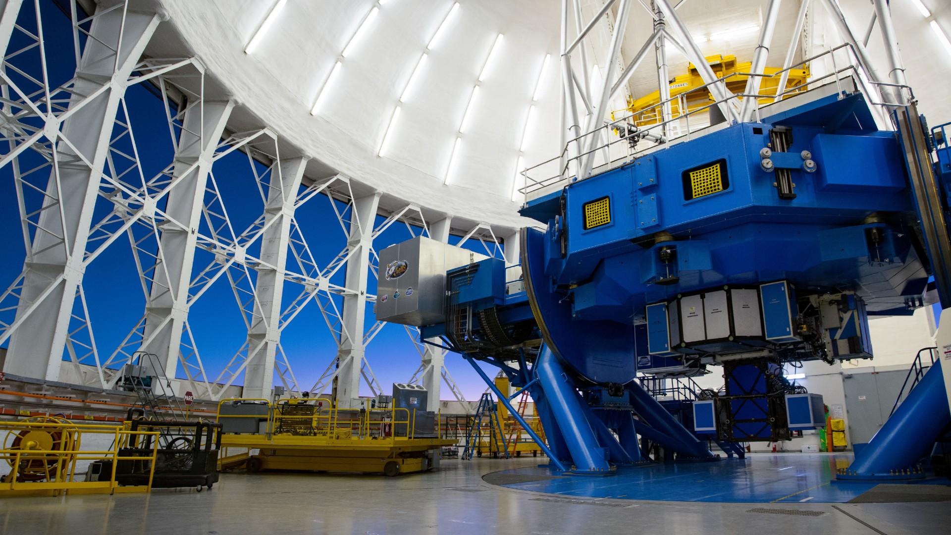 a large blue metal structure under a white dome