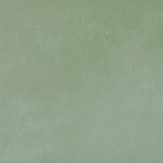 a stock photo of one desaturated concrete green tile