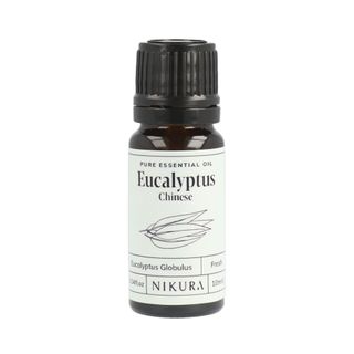 Black bottle of Nikura Eucalyptus Essential Oil with a white label 