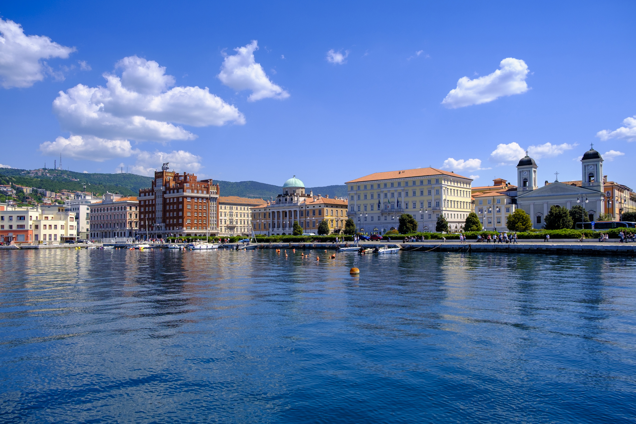 Trieste waterfront cityscape with historic architecture and harbor.