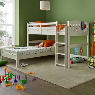 childrens room with L shaped bed and olive green walls