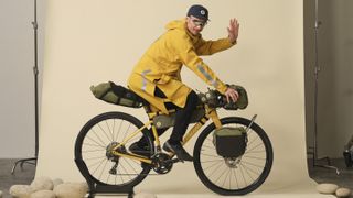 Specialized Fjalraven rain poncho being worn on a bike