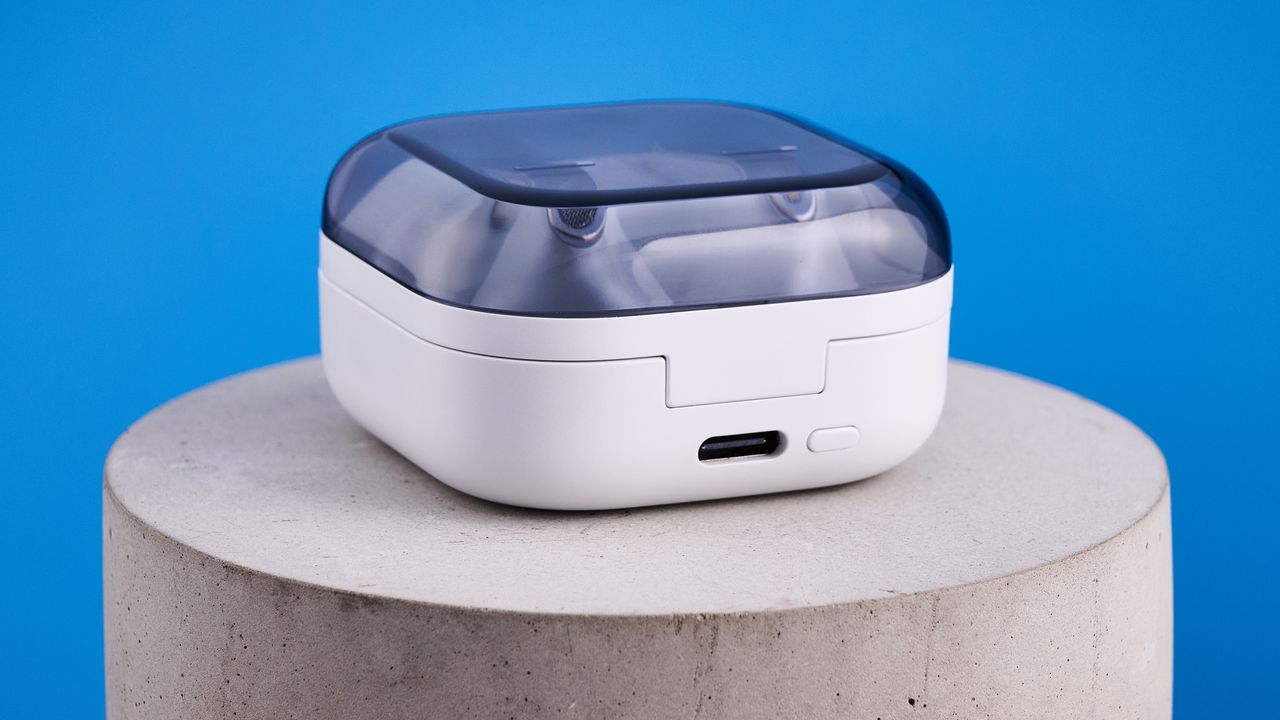 the samsung galaxy buds 4 pro in white photographed against the blue tom's guide background