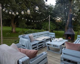 Gripsure decking with pallet sofas and chiminea