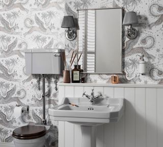 a bathroom with grey patterned wallpaper