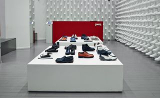 Nendo’s Madrid space for Camper features rows of white trainers fixed to its walls