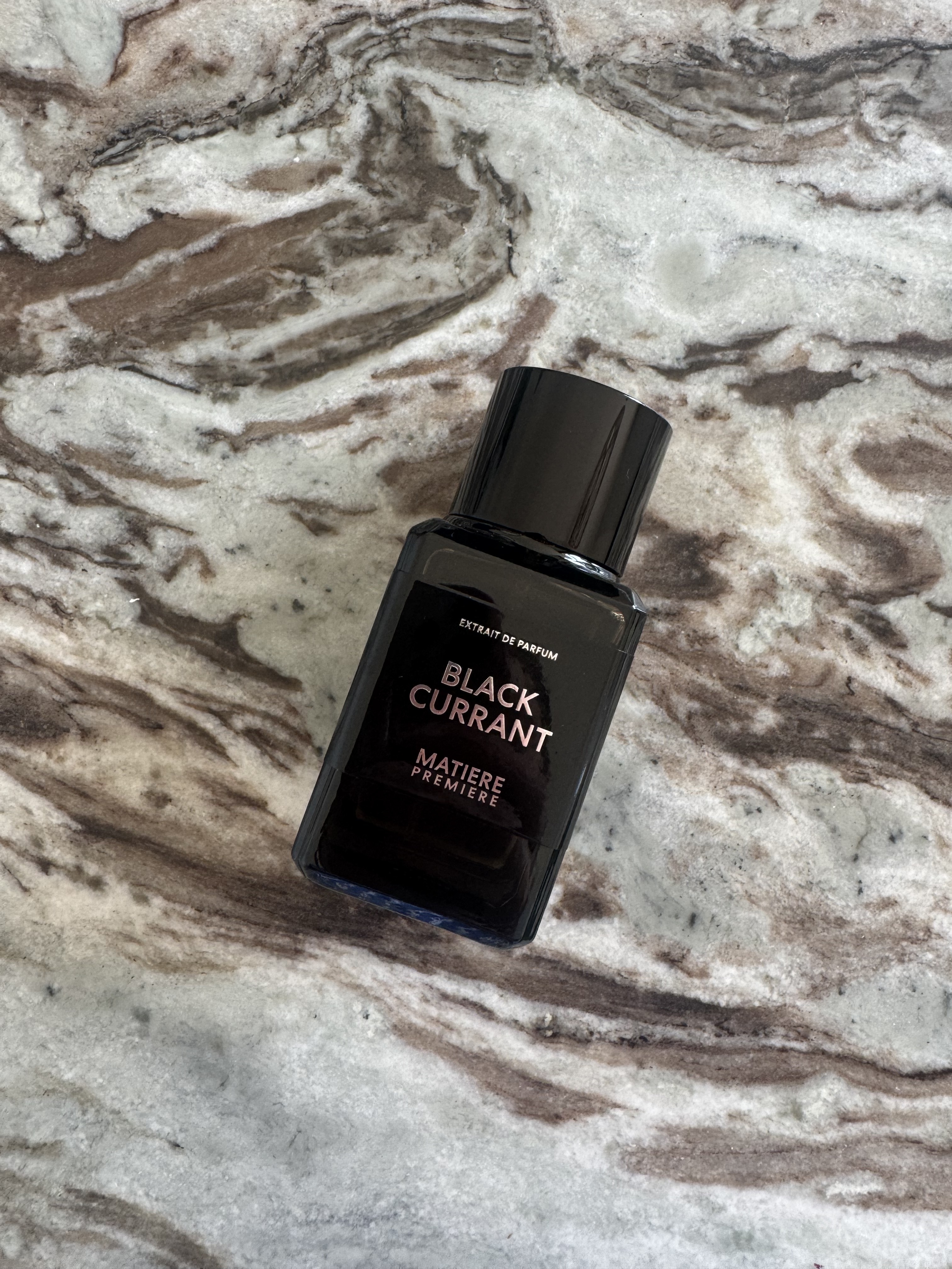 A bottle of Matiere Premiere Black Currant perfume