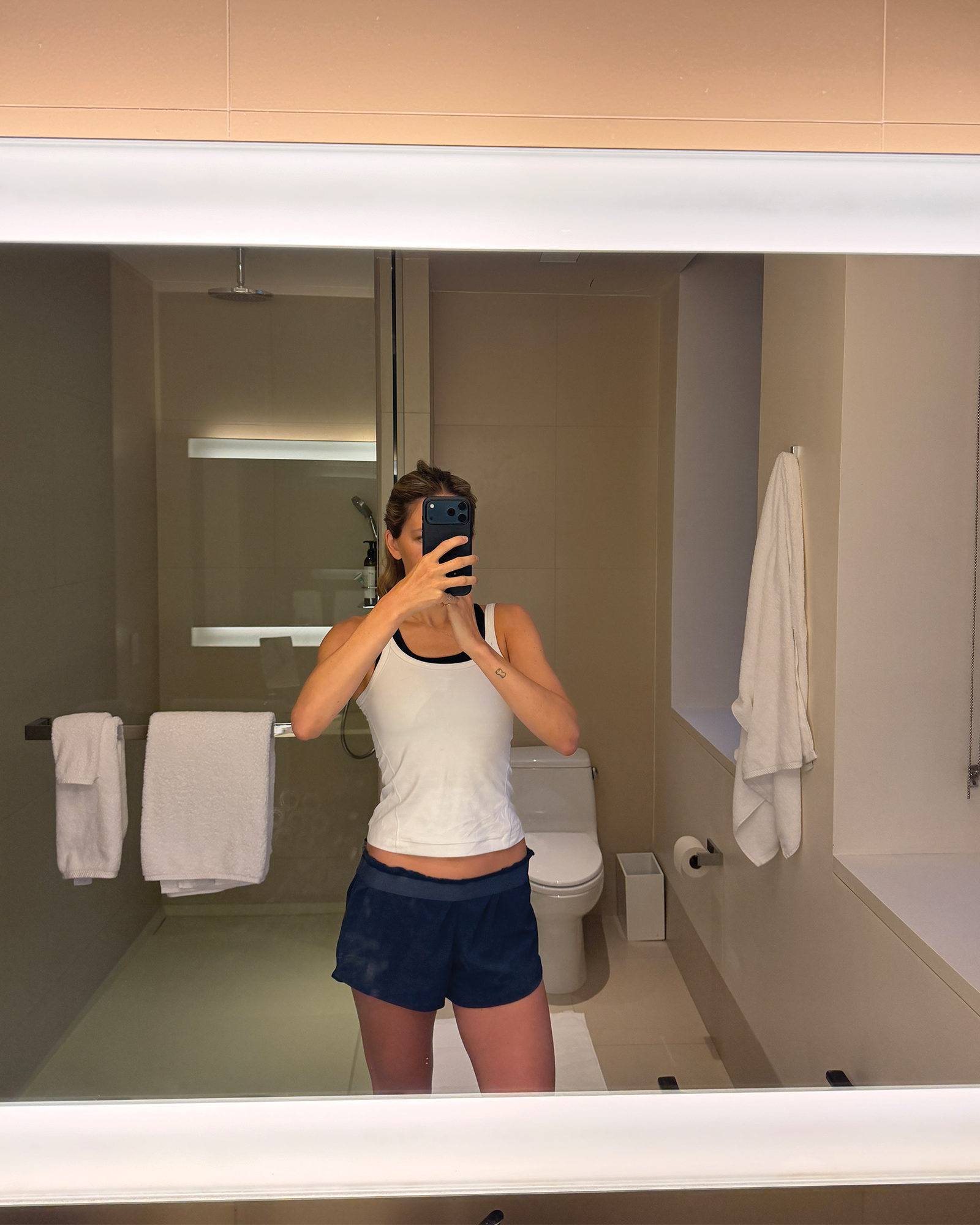 Eliza Huber brushing her teeth at the New York Edition before working out.