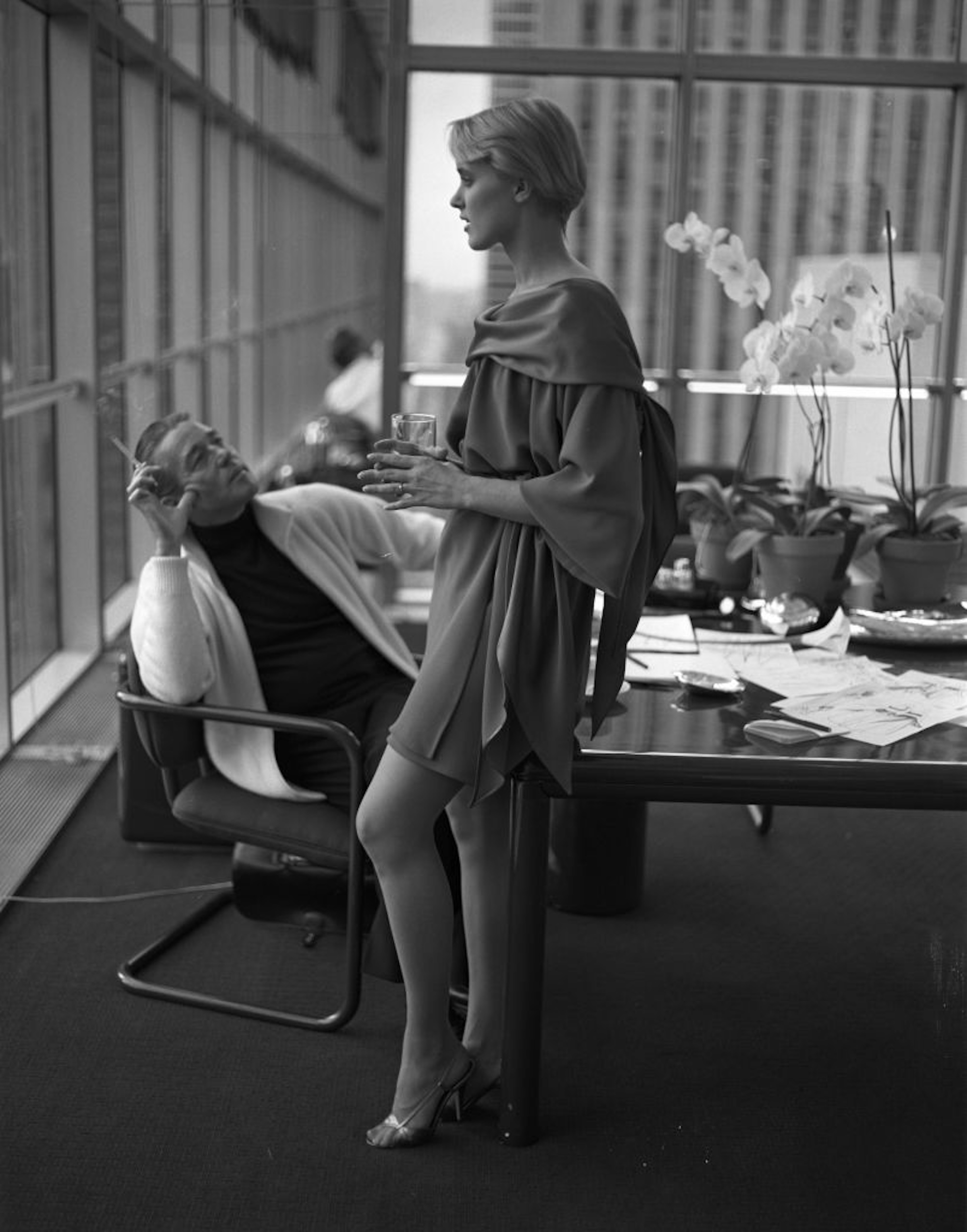 halston sitting alongside a model