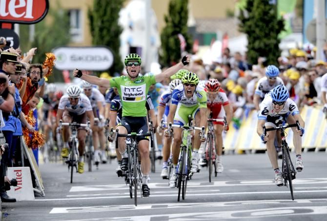Tour de France 2011: Stage 15. HTC-Highroad's Mark Cavendish (C) celebrates winning stage 15 and retaining the green points jersey