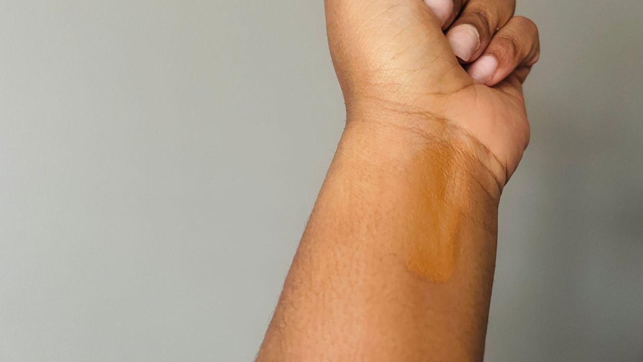 Maybelline Instant Age Rewind Eraser Concealer color swatch on a person's wrist, for the best drugstore concealers.