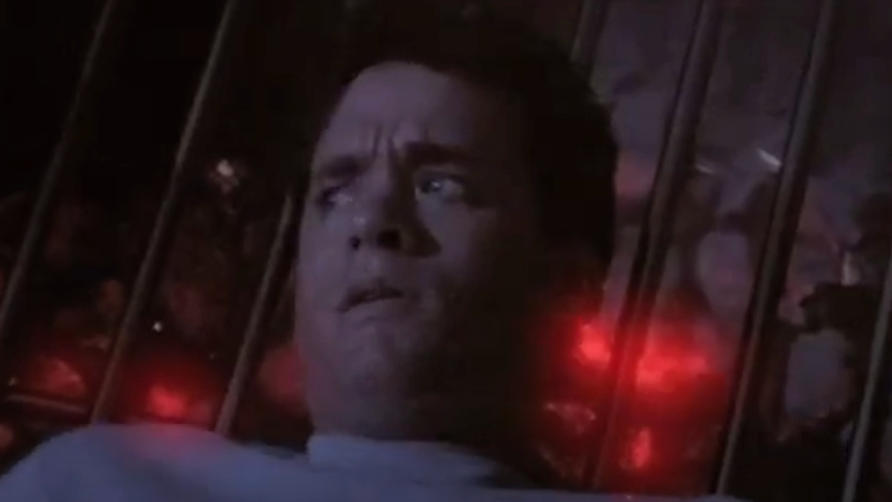 Tom Hanks laying on a giant barbecue pit in The 'Burbs