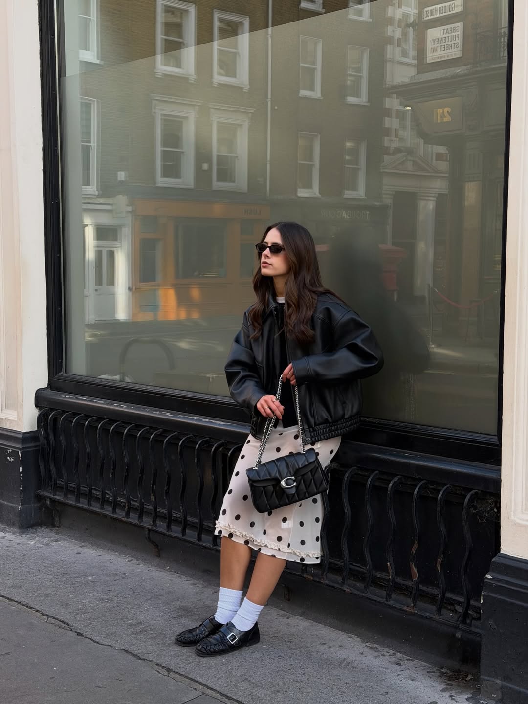 Influencer Tia Dewitt wearing a polkadot skirt.