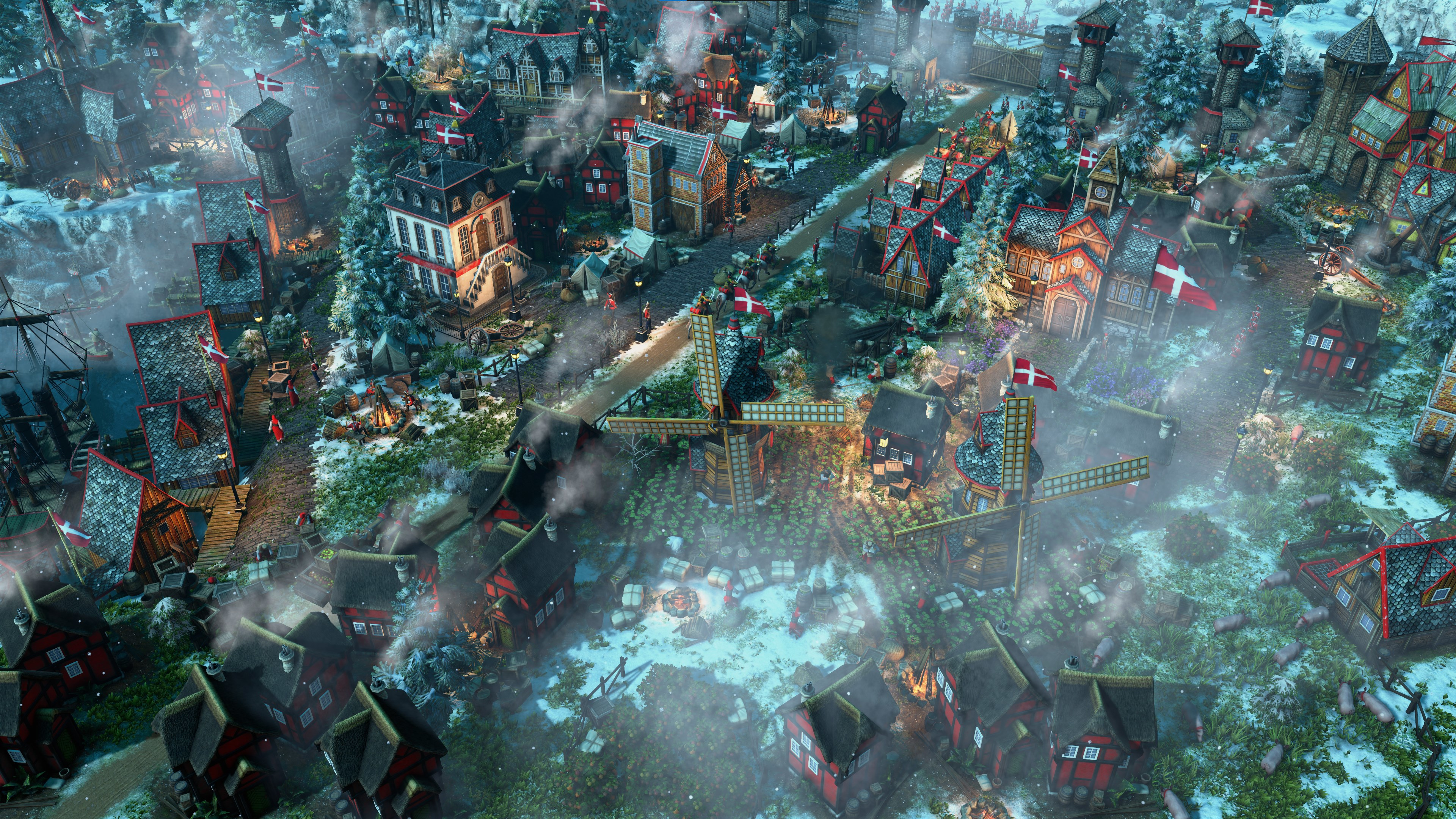 A vibrant winter village with traditional red Scandinavian-style houses, a large windmill, and mist, complete with people and flags, set against a snowy landscape.