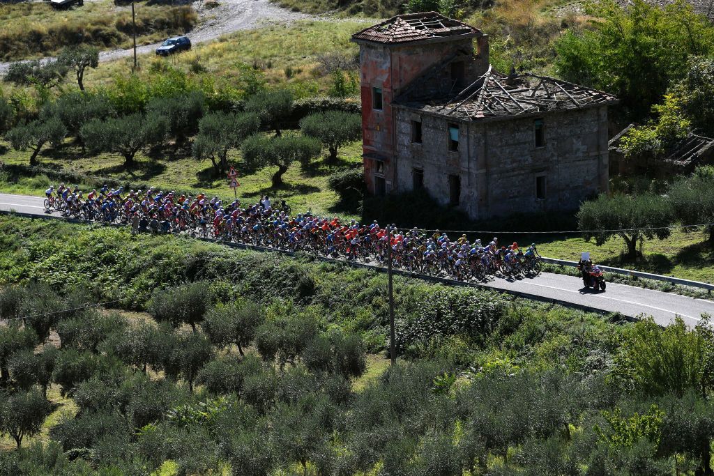 MATERA ITALY OCTOBER 08 Joao Almeida of Portugal and Team Deceuninck QuickStep Pink Leader Jersey Filippo Ganna of Italy and Team INEOS Grenadiers Blue Mountain Jersey Peter Sagan of Slovakia and Team Bora Hansgrohe Purple Points Jersey Harm Vanhoucke of Belgium and Team Lotto Soudal White Best Young Rider Jersey Campotenese 973m Peloton Landscape Mountains during the 103rd Giro dItalia 2020 Stage 6 a 188km stage from Castrovillari to Matera 401m girodiitalia Giro on October 08 2020 in Matera Italy Photo by Tim de WaeleGetty Images