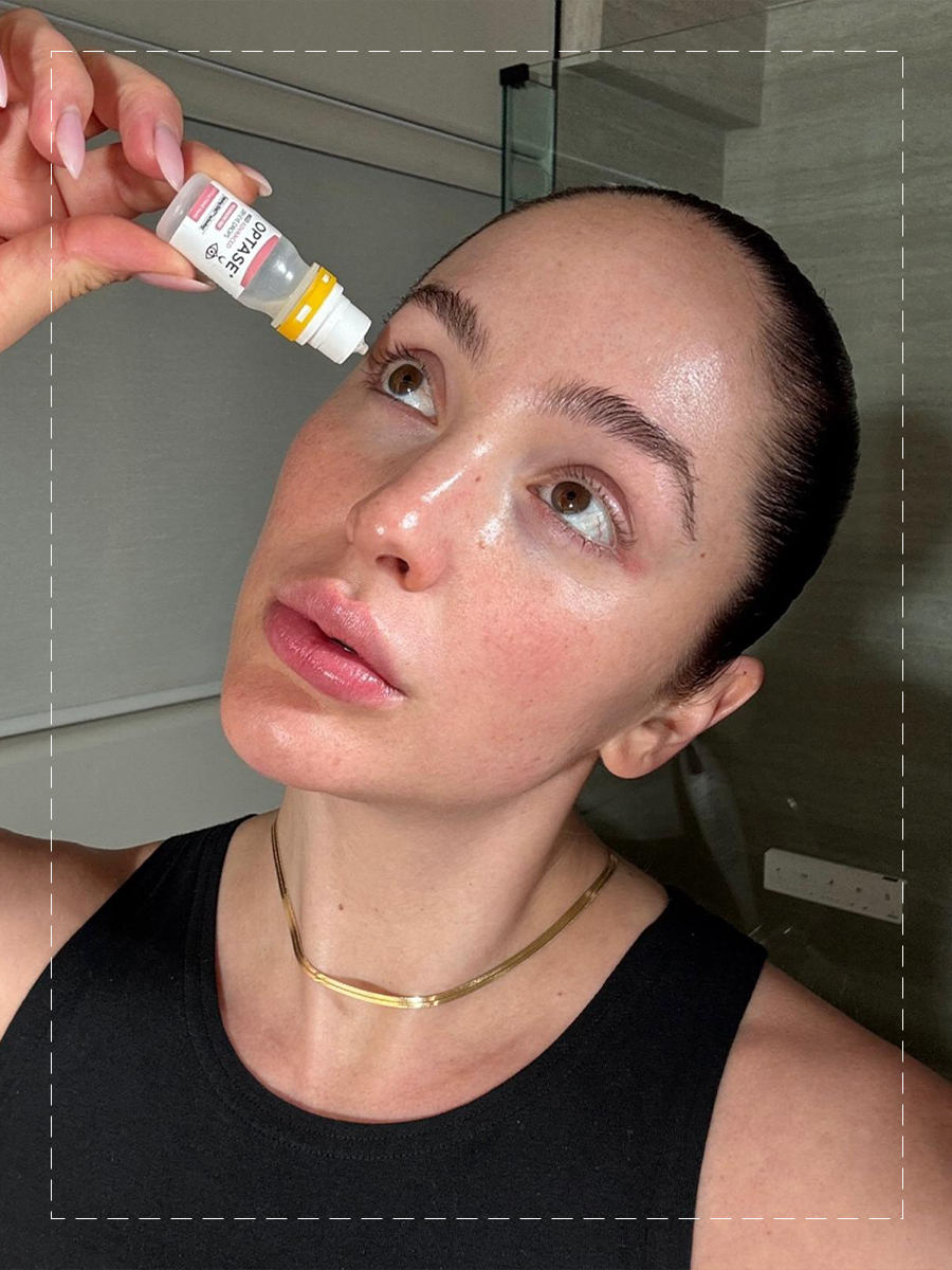 Ash K Holm using eye drops