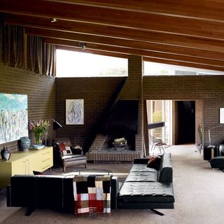 Living room with brick walls and fireplace