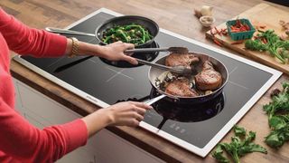 How do induction cooktops work?