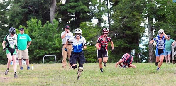 Open women run for their bikes.