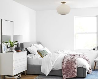 sculptural glass ribbed flushmount light in a small bedroom- west elm