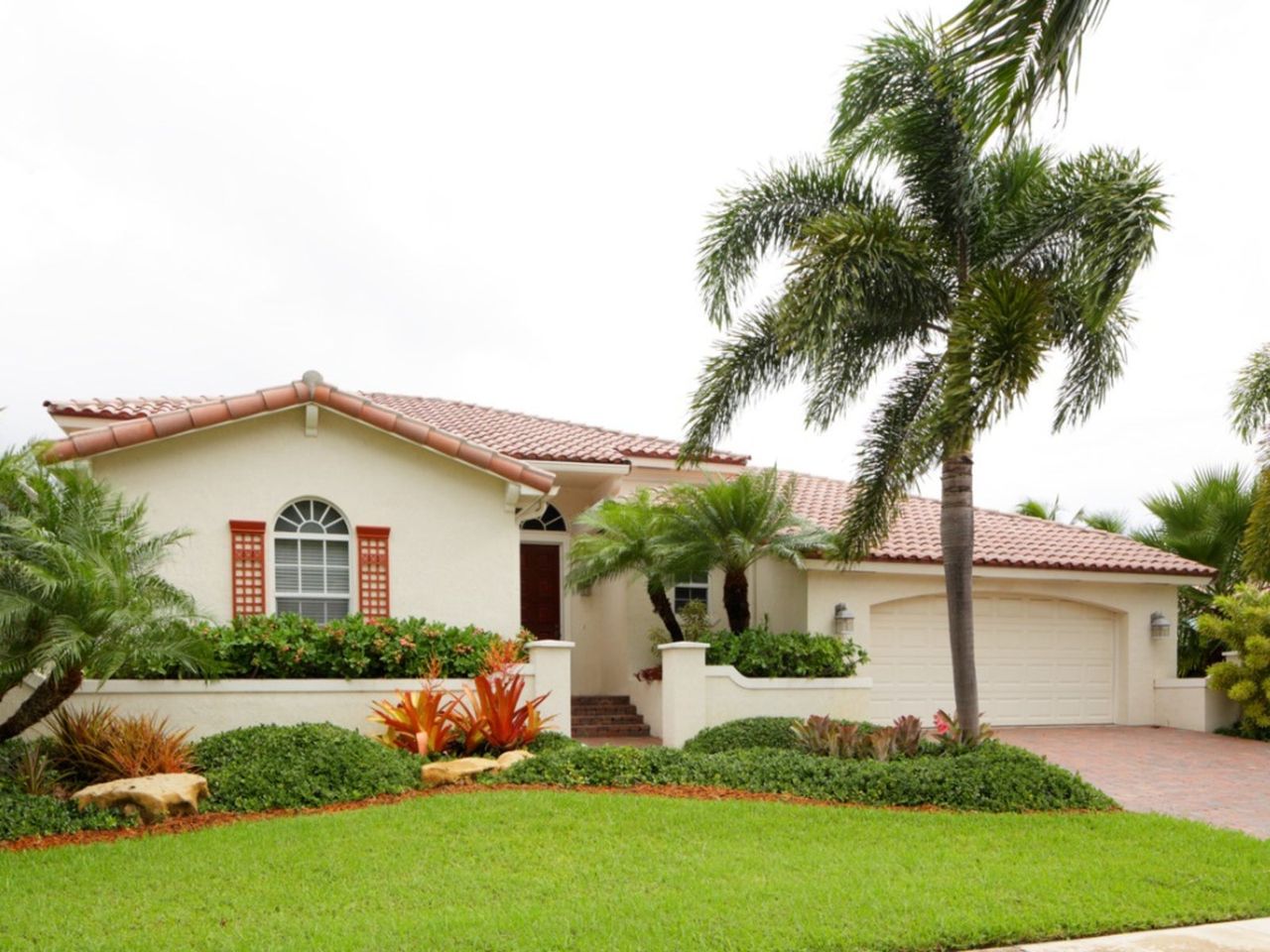 Palm Tree In The Front Yard Of A House