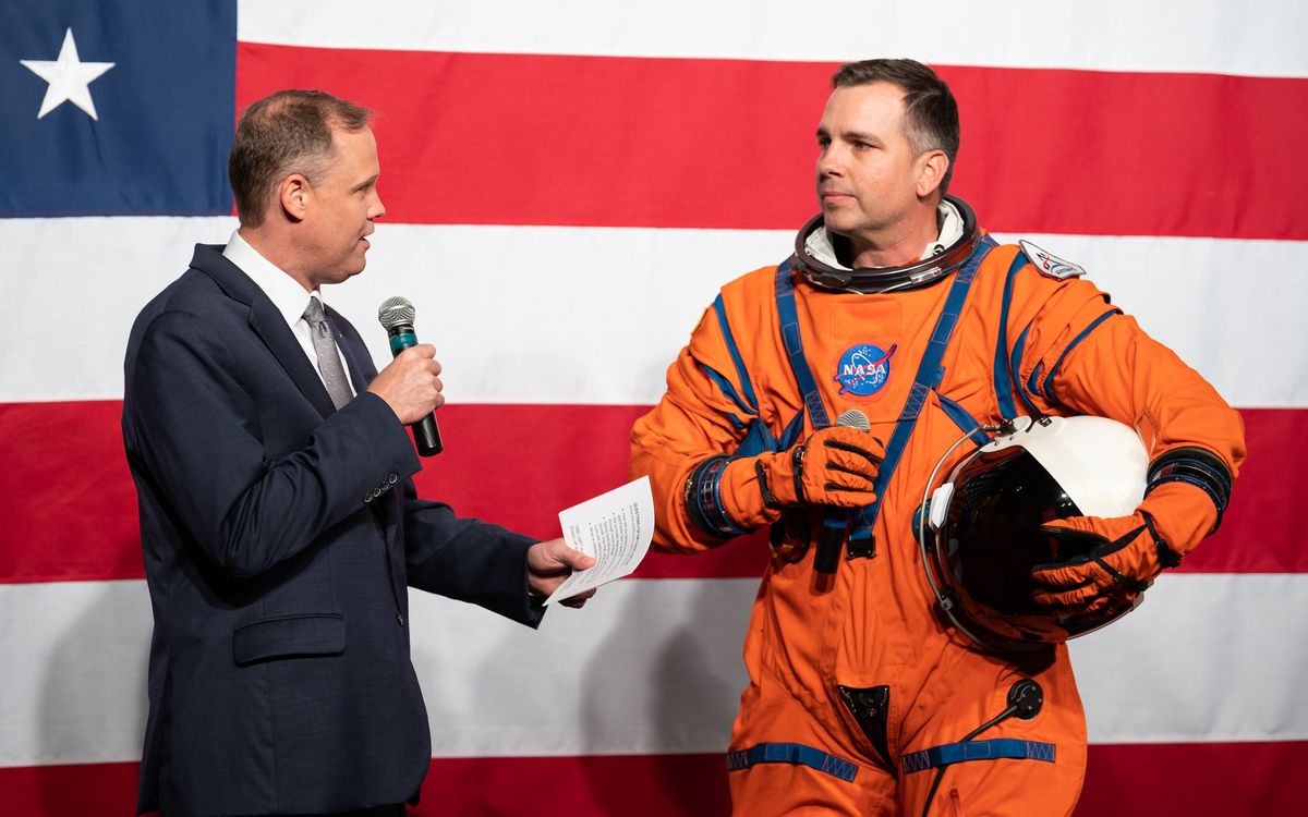 NASA Administrator Jim Bridenstine, left, speaks with Dustin Gohmert, Orion Crew Survival Systems Project Manager at NASA&rsquo;s Johnson Space Center, wearing the Orion Crew Survival System suit, about the suit, Tuesday, Oct. 15, 2019 at NASA Headquarters in Washington.