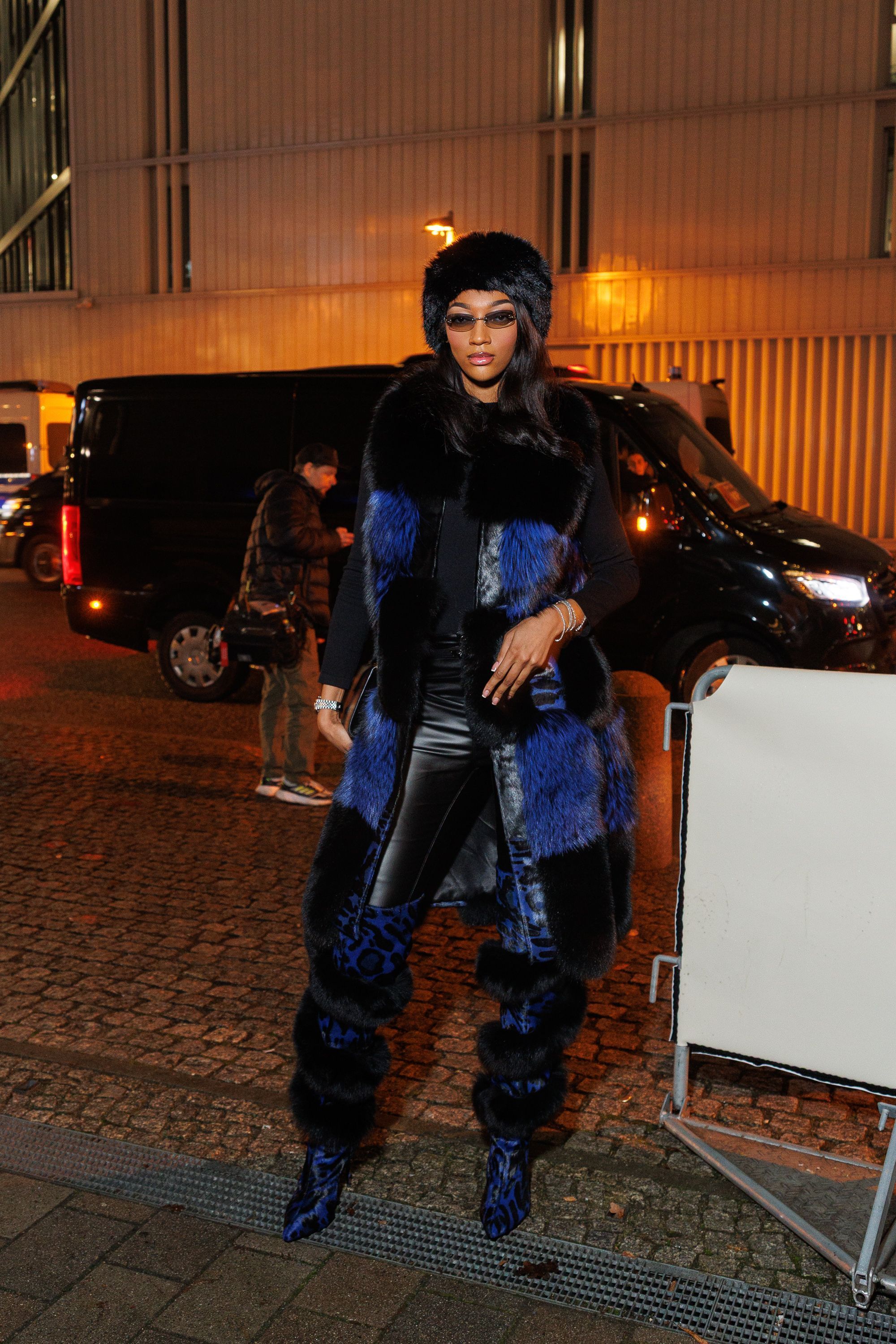 Angel Reese attended a NBA game in Germany wearing a leather and fur winterwear look
