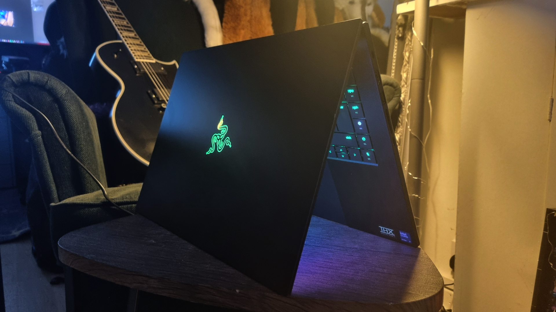 A Razer Blade 16 (2026) gaming laptop standing on its end in an open position