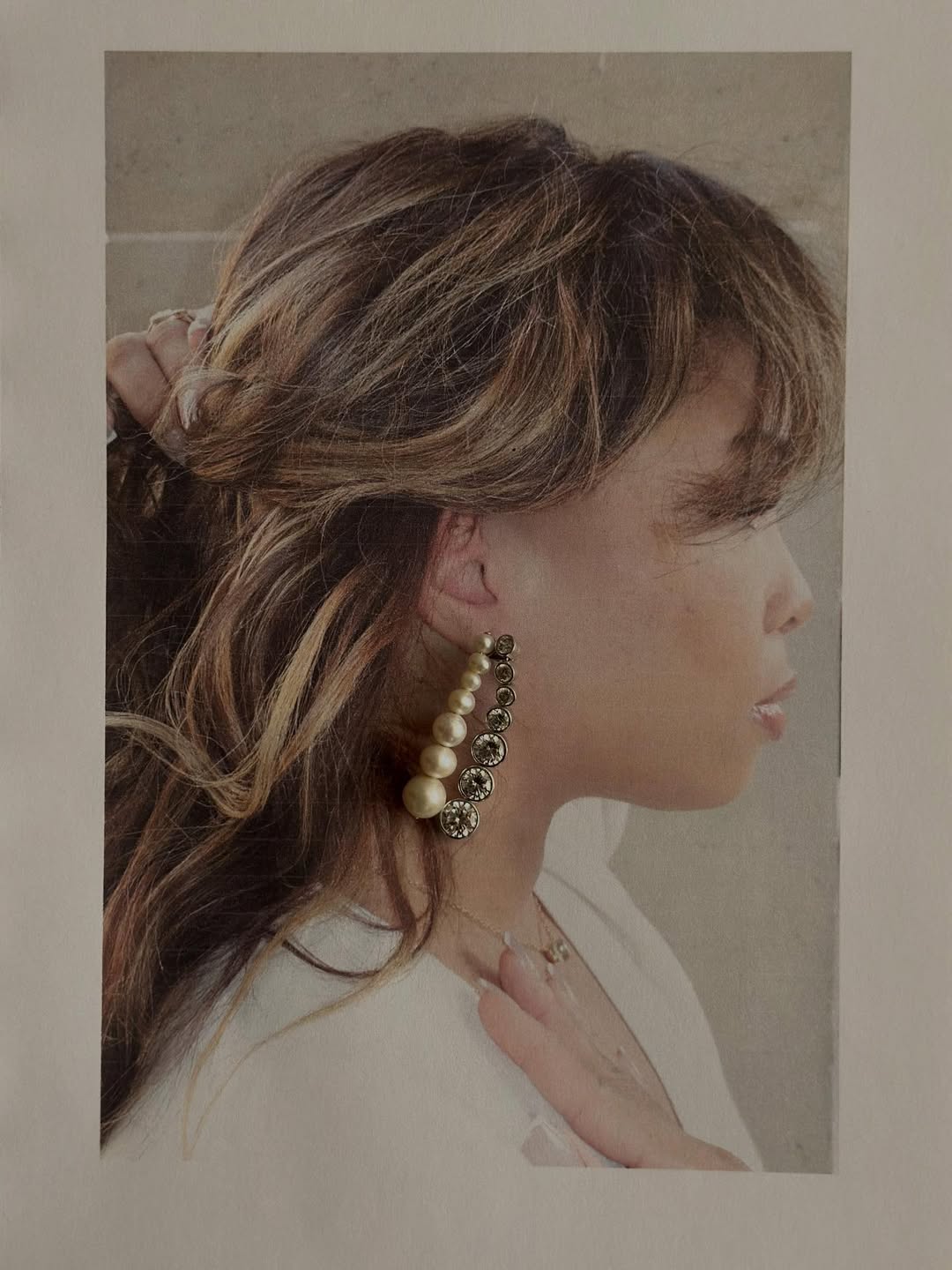 Ellie wears statement earrings