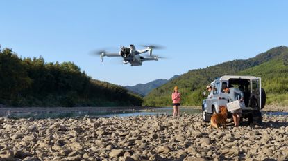 Best drones for beginners: people flying the DJI MINI 3