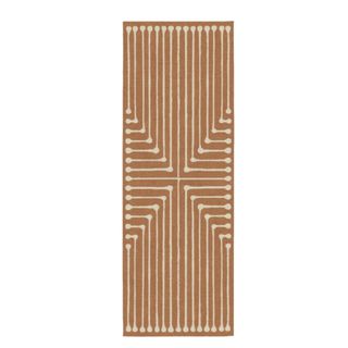 A gold and white teardrop patterned runner rug