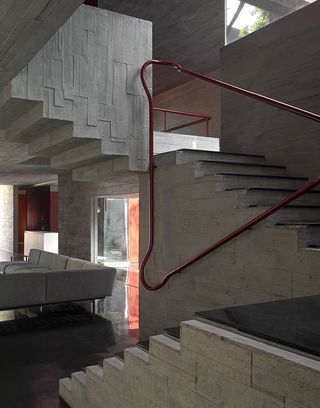 concrete stairwell at Trees Sliced Through by Matharoo Associates