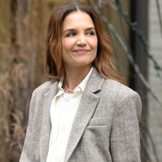 Katie Holmes layered a white T-shirt underneath an early fall flannel