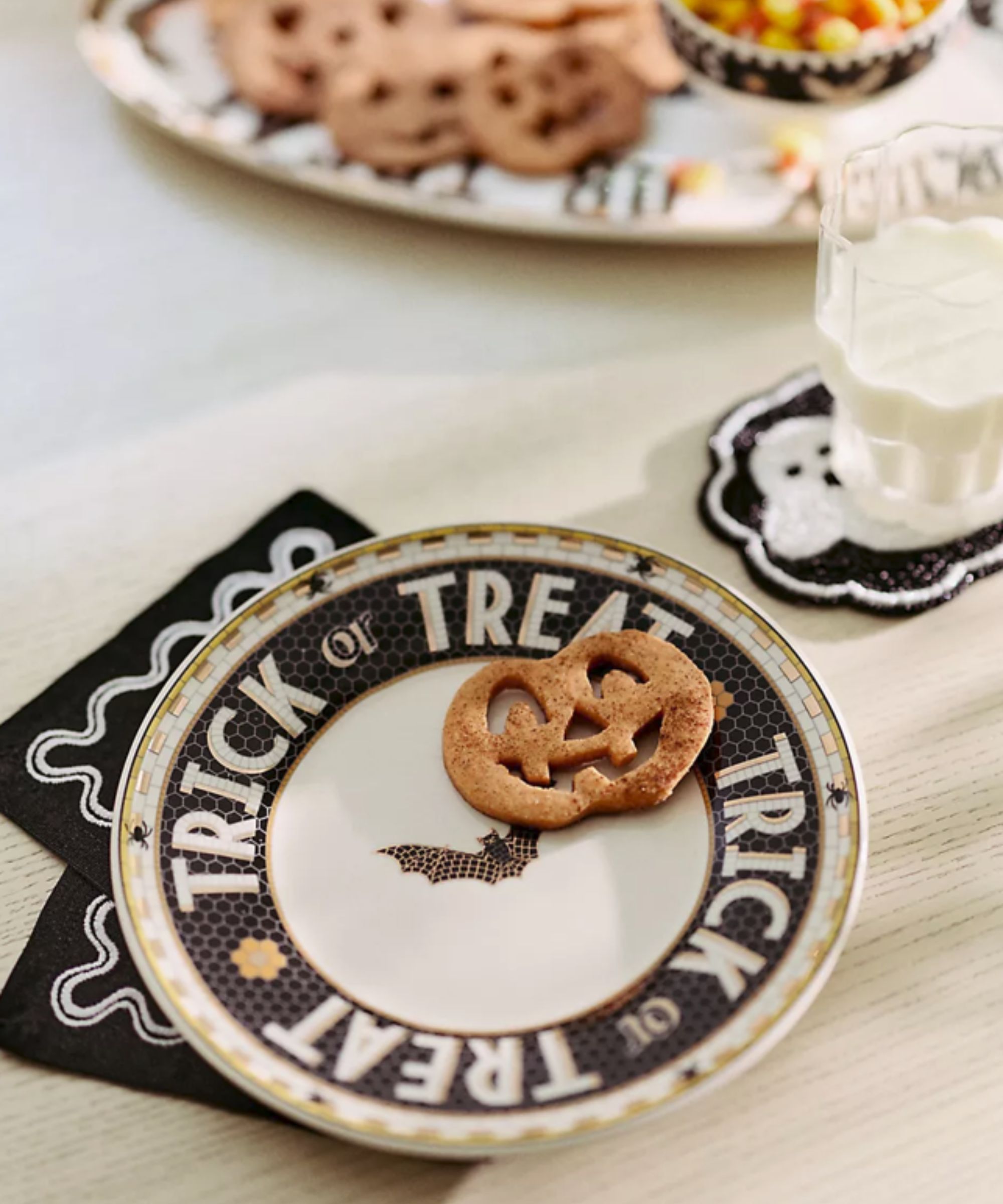 Trick or treat plate with pumpkin biscuit on it