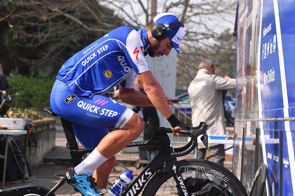 Fernando Gaviria (Quick-Step floors) catches up with electronics while riding his trainer.