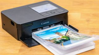 Canon SELPHY CP1500 Wireless Compact Photo Printer being tested in writer's home