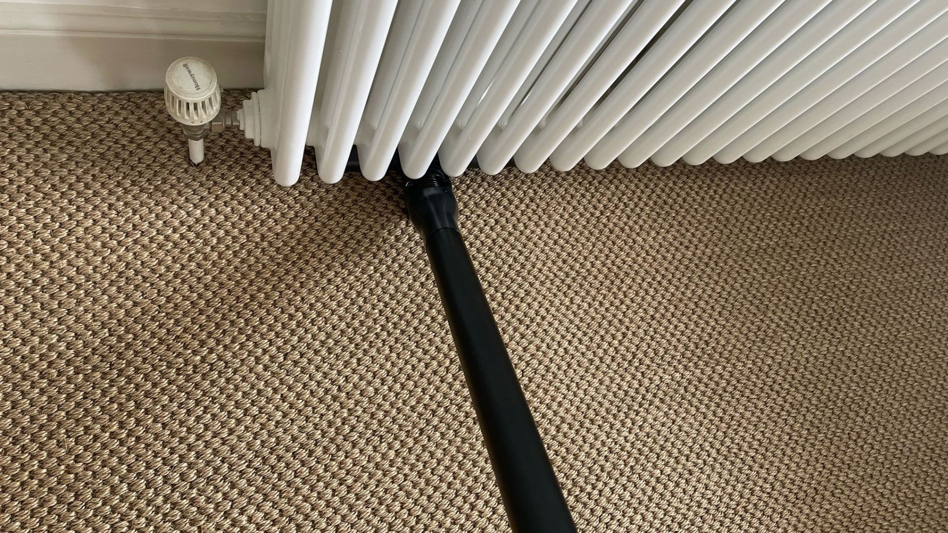 Samsung Bespoke AI Jet Ultra Vacuum under radiator