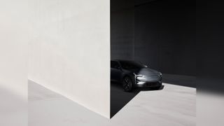 A car against a monochrome walled background