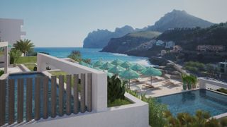 Glimmering blue seas and a modernist whitewashed hotel building