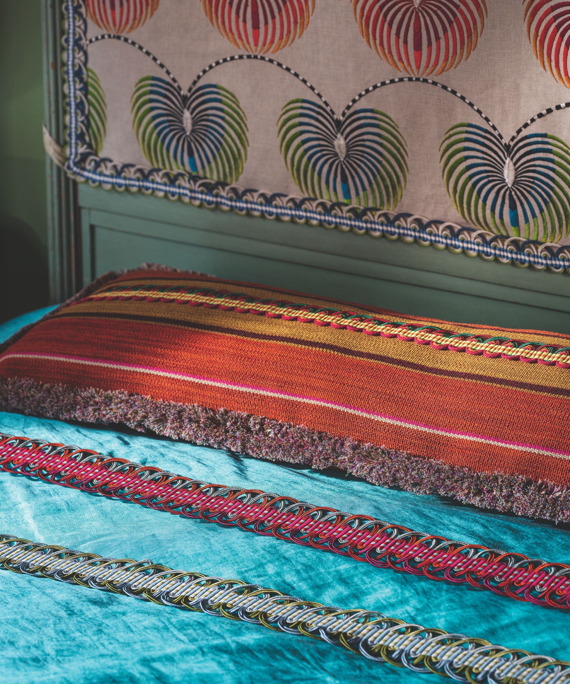 Bright fabric trims in turquoise, red and burnt orange