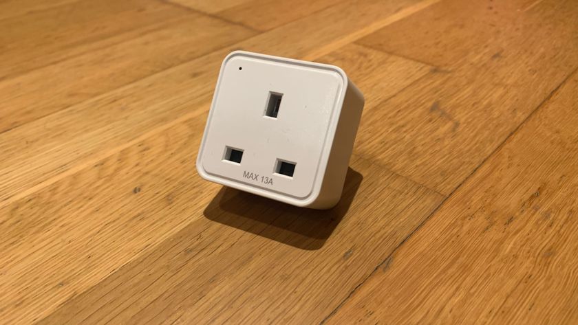 WiZ Smart Plug on a wooden floor